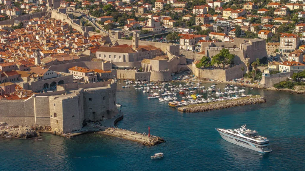 a Historic Coastal Town with Stone Walls Red tiled Roofs and a Harbor Filled with Boats